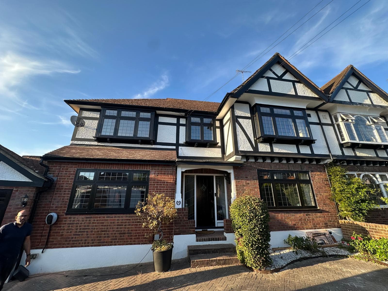 Tudor-style Buckinghamshire home with complete anthracite aluminium window replacement enhancing the traditional facade