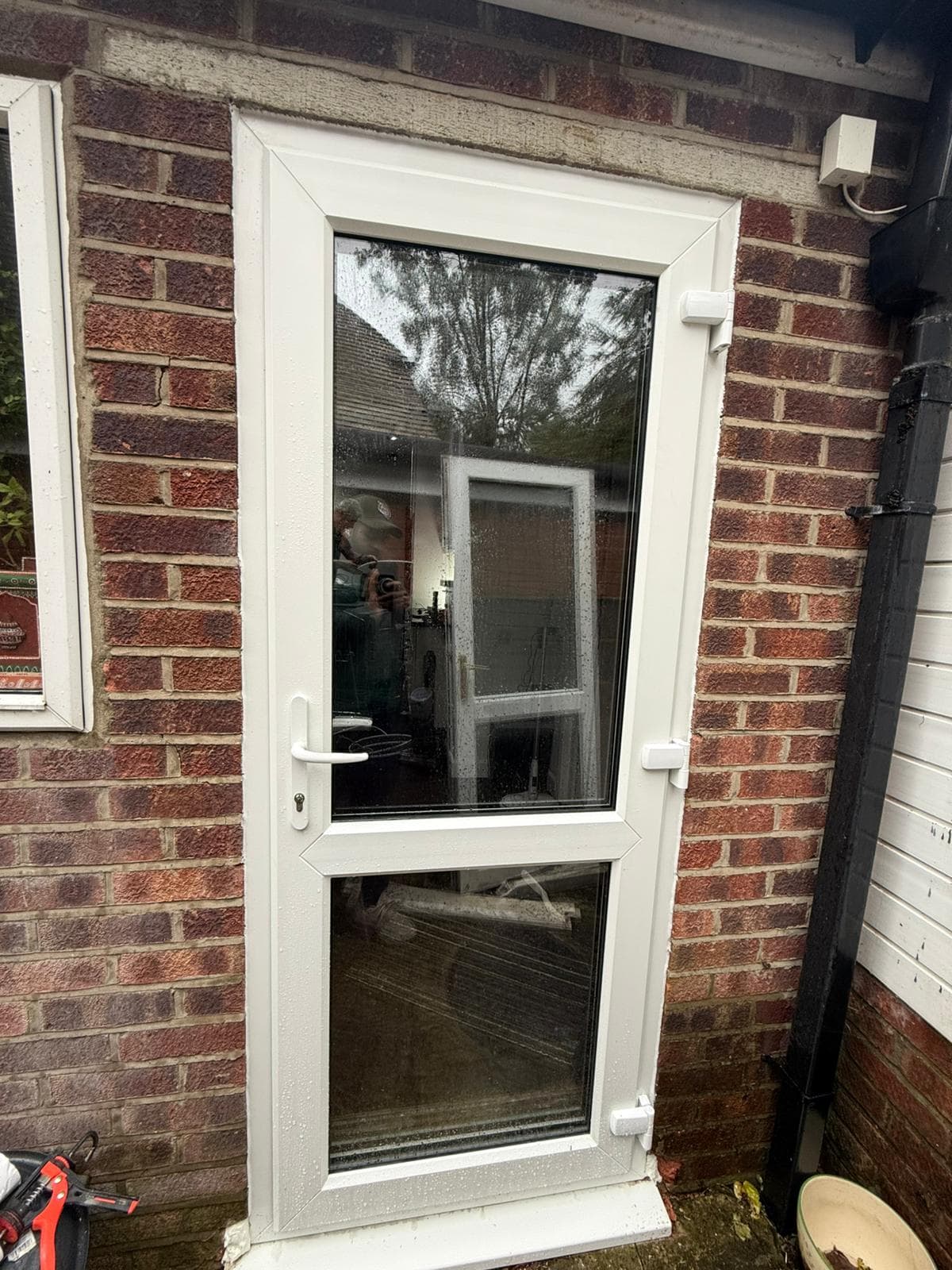 White uPVC single back door with half-glazed panel