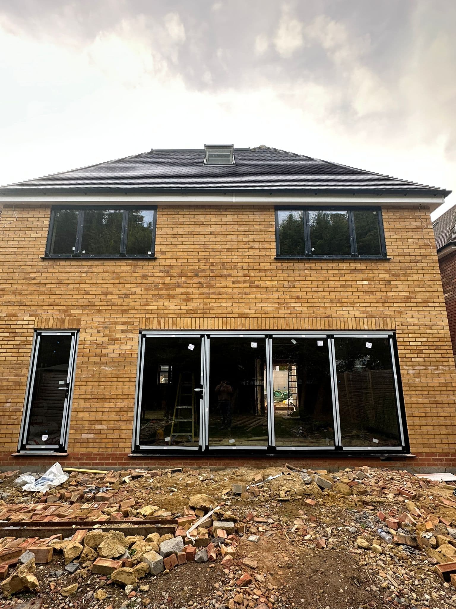 Slimline aluminium casement windows and sliding doors with minimal sightlines on a modern UK home