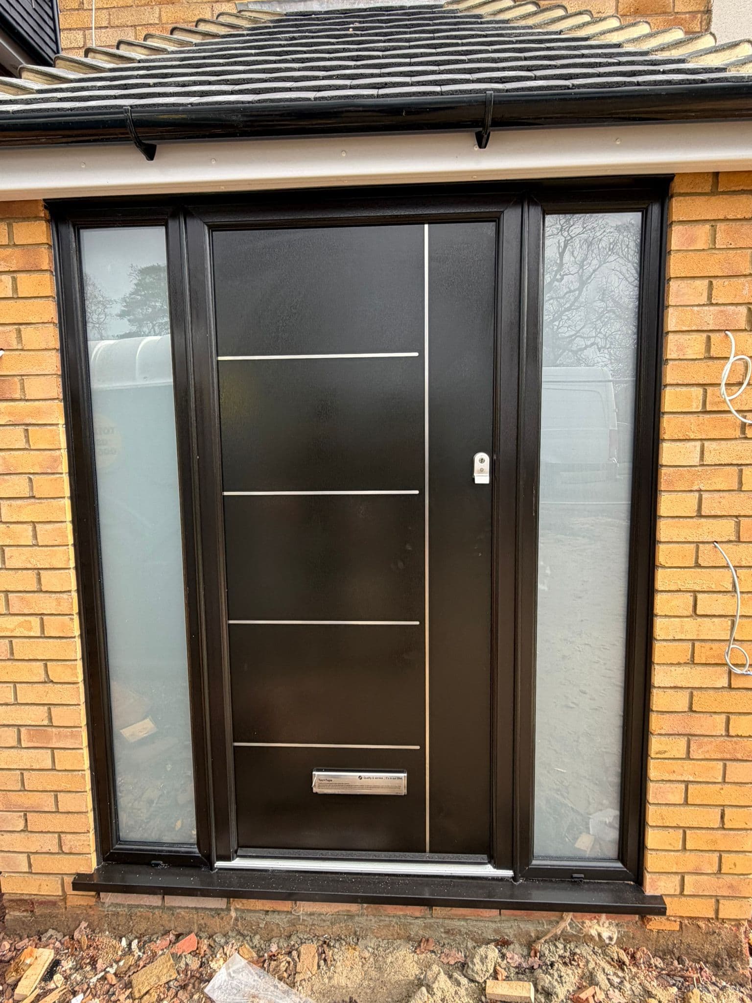 Palladio composite entrance door in contemporary black with sidelights
