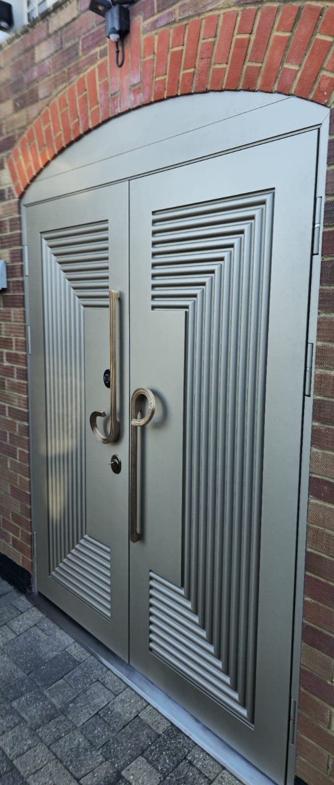 Silver art deco steel double entrance doors with geometric pattern