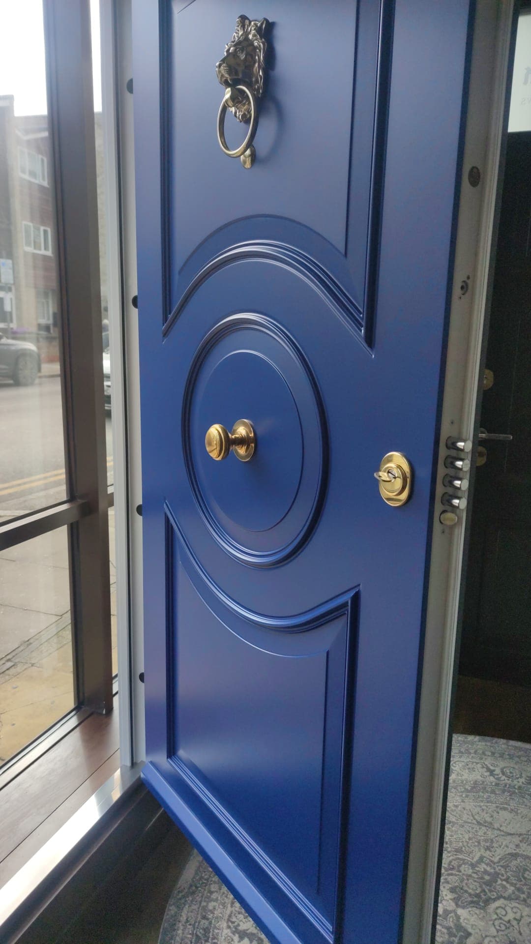 SteelR cobalt blue ornate steel door with lion knocker