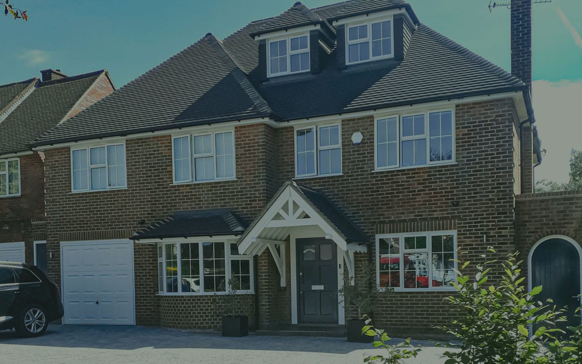 Modern anthracite grey aluminium casement windows on a UK home, low-maintenance powder-coated frames