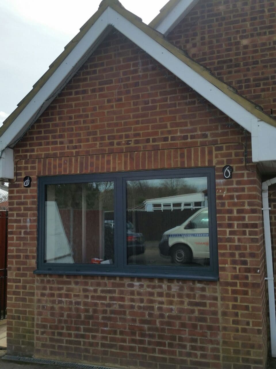 Cortizo Cor 70 Hidden Sash aluminium flush casement window on a brick gable wall