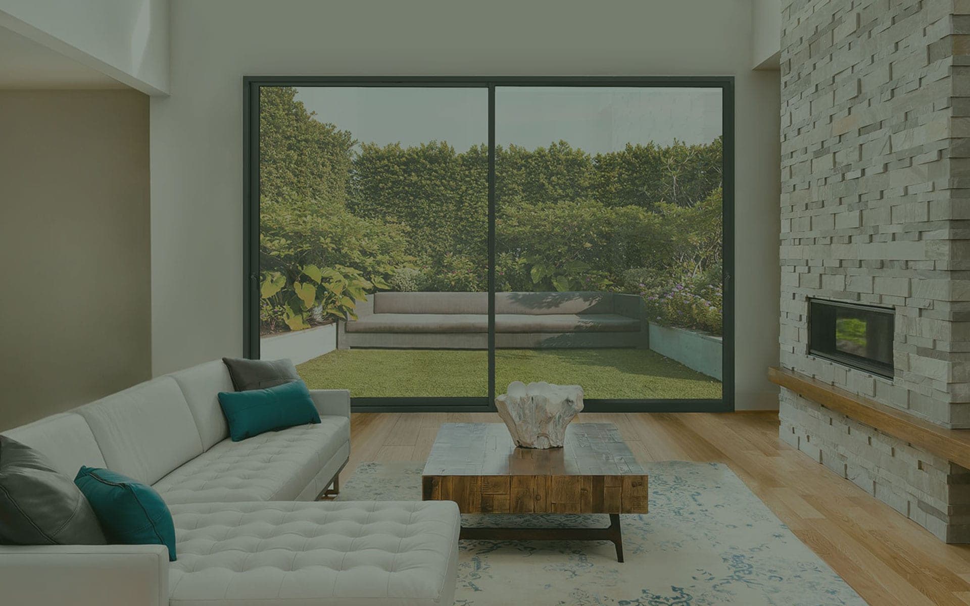 Wide aluminium sliding door with slim sightlines opening onto a landscaped garden in a contemporary Buckinghamshire home