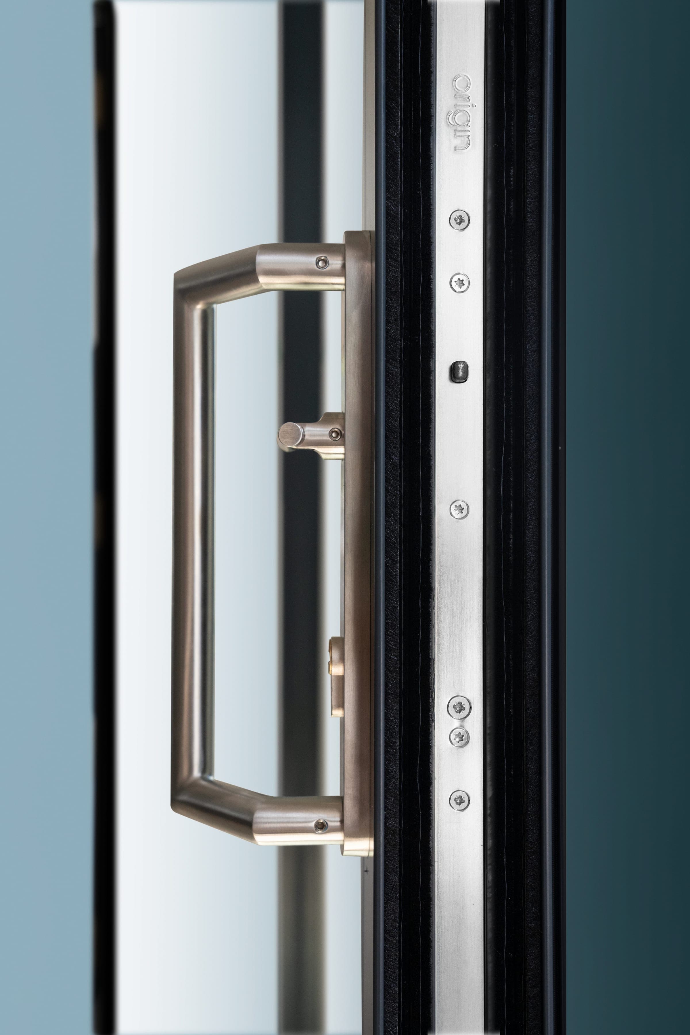 Origin OS-29+ aluminium sliding door showing the contemporary offset handle detail