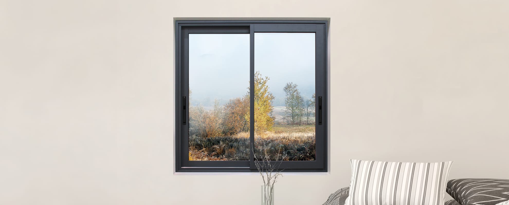 Cortizo 4900 Sliding HI aluminium sliding window in anthracite frame with garden view